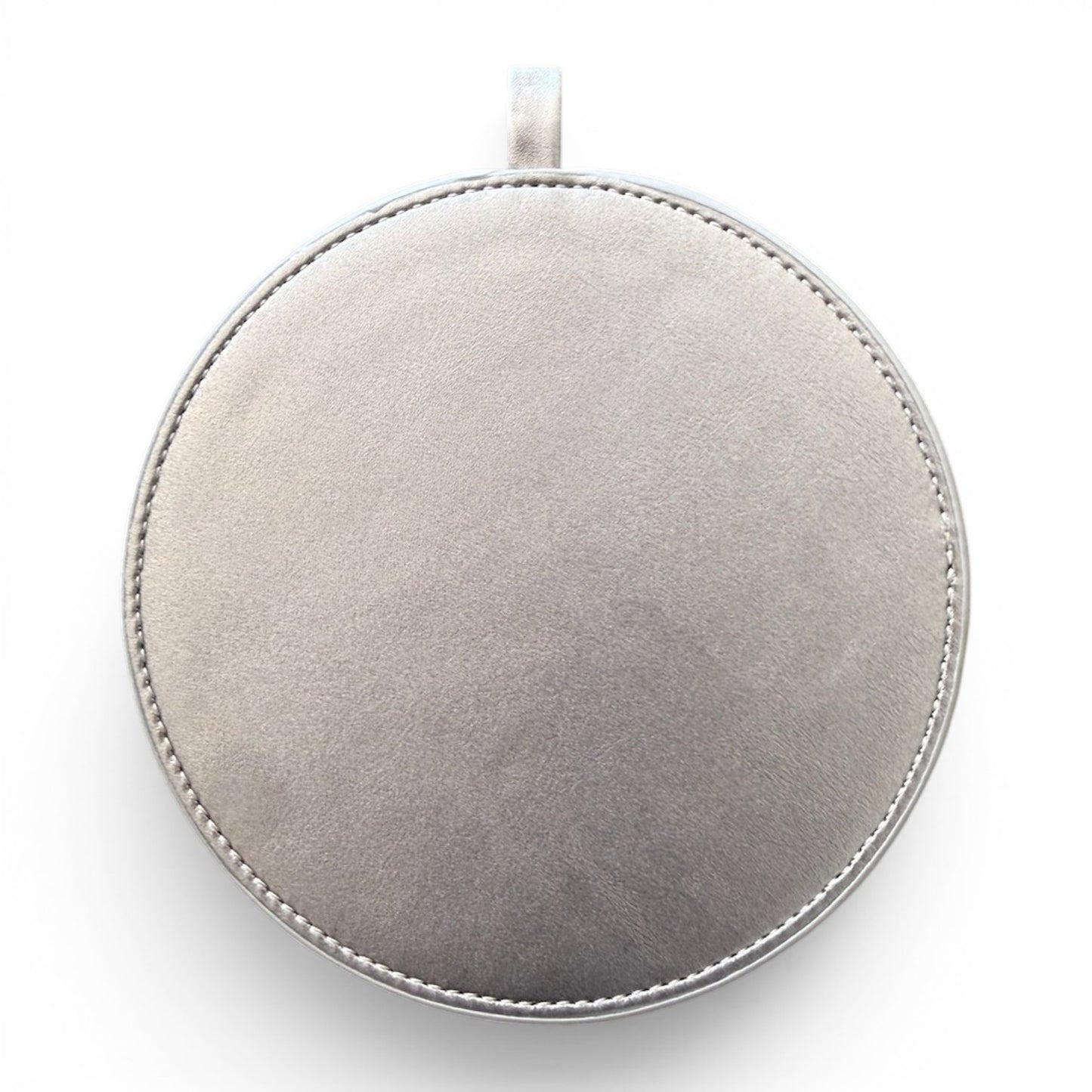 A round silver pendant or medallion with a stitched edge and a small loop at the top, shown against a plain white background.