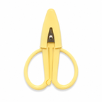 A pair of small utility scissors with a solid pale yellow plastic body and a silver metal pivot screw, shown against a plain white background.