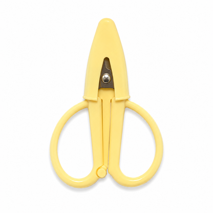 A pair of small utility scissors with a solid pale yellow plastic body and a silver metal pivot screw, shown against a plain white background.