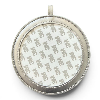 A round silver-toned leather pendant or ornament with a stitched border and 3m adhesive backing, shown on a white background.