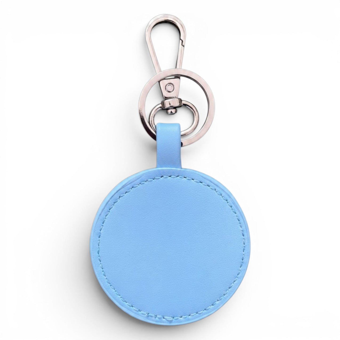 A light blue circular leather keychain or bag charm with a silver-tone metal clasp and key ring, shown on a plain white background.